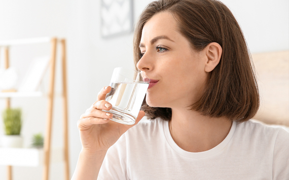 Woman Drinking Distilled Water